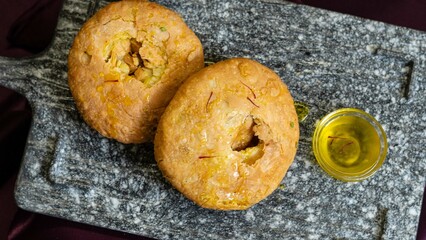 Famous Mawa Kachori, Kachauri or Kachodi, Stuffed Kachori With Condensed Milk And Served With Sugar...