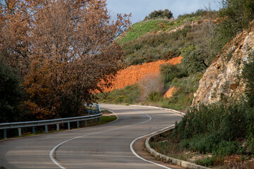 Curvy stretch of road in the interior region of Spain ideal for motorcycling travelers - obrazy, fototapety, plakaty