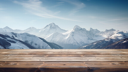 Empty wooden deck table on the snowy mountains background. - obrazy, fototapety, plakaty