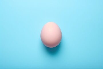 Minimal fashion concept with a pink egg on light blue pastel background, flat lay. - Powered by Adobe