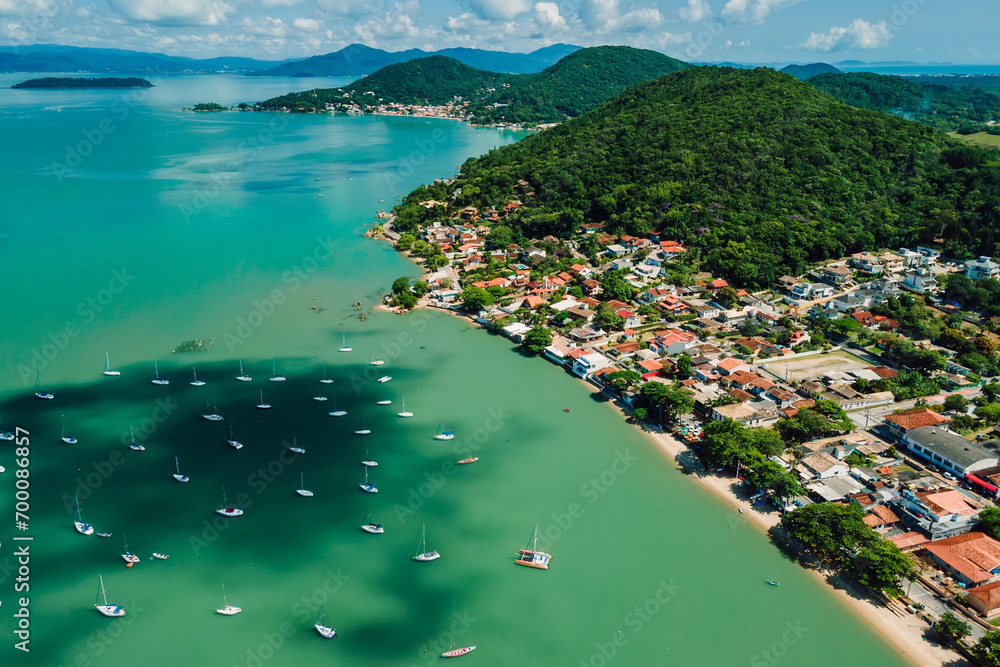 Wall mural coastline in santo antonio de lisboa with sailing boats in sea in brazil. aerial view.