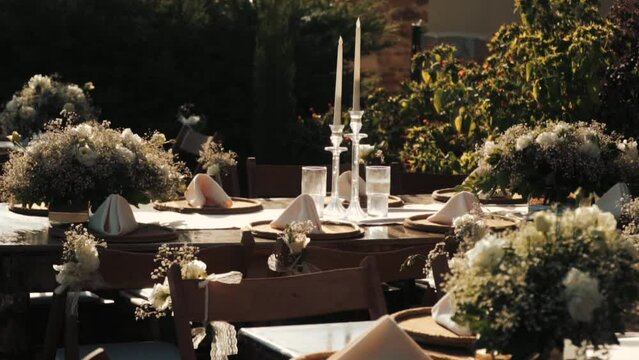 Wedding day event organization table setting decor luxury event. Wedding Decor. A large number of brown wooden chairs are lined up against the backdrop of the wedding decor. 