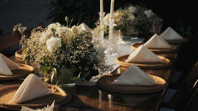 Wedding day event organization table setting decor luxury event. Wedding Decor. A large number of brown wooden chairs are lined up against the backdrop of the wedding decor. 