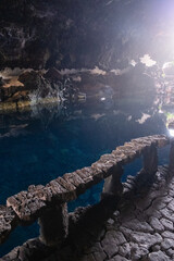 Interior of the cave of Los Jameos del Agua. Light at the end of the cave. Lanzarote, Canary Islands, Spain.