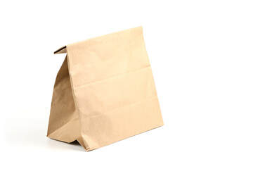 Close and full paper disposable bag of brown kraft paper isolated on white background.