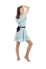 Young beautiful girl in a dress with polka dots on a white background.