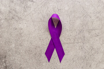 Purple ribbon - pancreas cancer awareness and Alzheimer's disease concept
