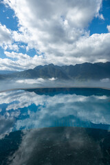 Mountain with clouds sky reflection with water in infinity pool in Sa Pa, Vietnam