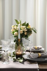 Beautiful table setting with floral decor indoors