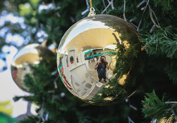 Blurry of Christmas and New Year's balls with beautiful decorations on the Christmas tree, soft light, beautiful background images and illustrations.
