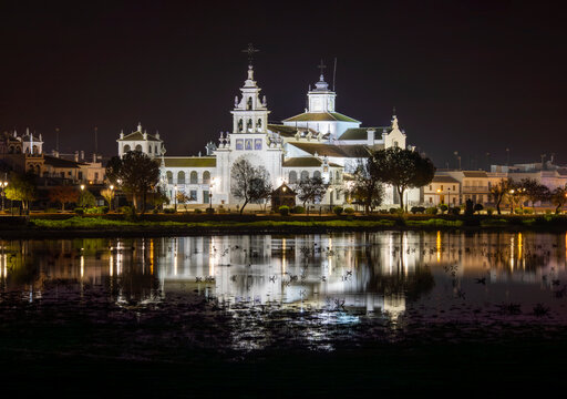 Ermita del Rocio, Huelva, Andalusia, Spain, illuminated at night with its reflection in the marsh
