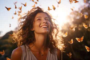 Happy brunette woman excited looking up in the butterflies - obrazy, fototapety, plakaty