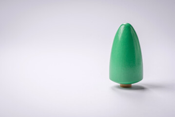 Wooden model of a tree with a green crown and trunk on a white background