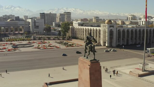 A circular flyby of the Monument to the hero Manas on horseback in the center of Bishkek, on Ala-Too Square. Travel to Kyrgyzstan.