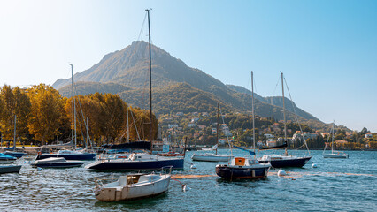 Lecco lake with sailboats at bay