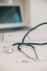 stethoscope for doctor checkup on health medical laboratory table background