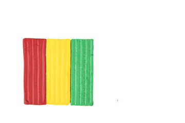 Multicolored plasticine, kids plasticine in the form of cubes and strips. transparent isolated background