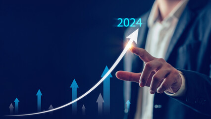 2024 Business goal, Business man pointing chart graph with 2024, future marketing technology...