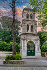 Fototapeta na wymiar Lush green gate leads to the historic Ayios Panteleimonas Church in Kuzguncuk, Istanbul, Turkey. The church's Byzantine architecture is exquisite, and its tranquil setting offers a welcome respite