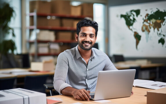 Freight forwarder manager using laptop.