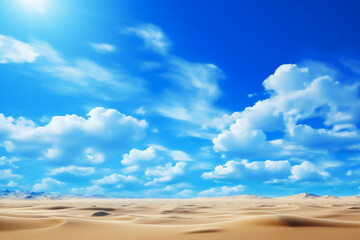Fototapeta premium Horizontal image of a desert landscape under a bright blue sky covered with white clouds. It can be used in articles or documentaries about deserts, climate or natural landscapes.