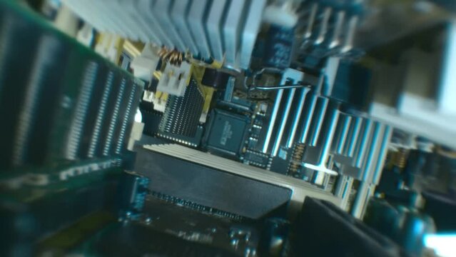 Electronic boards with many different microcircuits and other radio components show the complexity of the products of the modern electronics industry. Closeup. Macro. Shallow depth of field. Shot in m