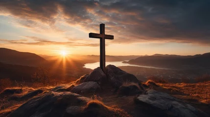 Foto op Plexiglas Holy christian religious cross at sunrise on top of hill crucifix © Barosanu