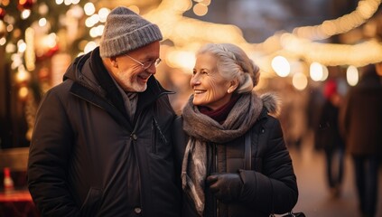 Senior couple enjoying winter walk in christmas market