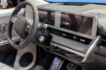 Obraz premium Modern car interior with steering wheel