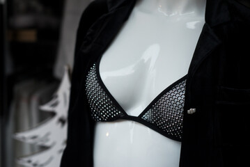 Closeup of black bra on mannequin in a fashion store showroom