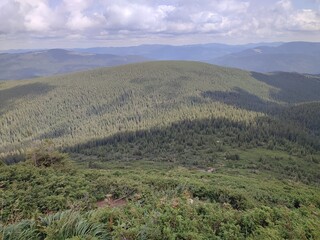 A view of the mountains from a height in the warm season