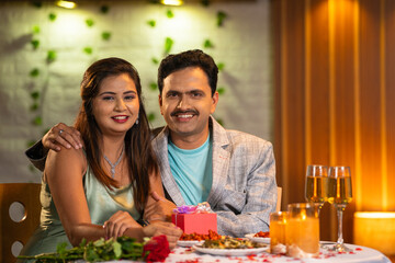 portrait shot of Joyful romantic couples at candlelight dinner looking camera at restaurant -...