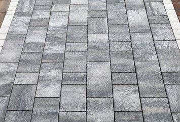 Concrete tiles for outdoor pavements. Colors are shades of gray. Background and texture.