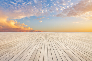 Fototapeta na wymiar Empty wooden board space and sunset sky cloudscape