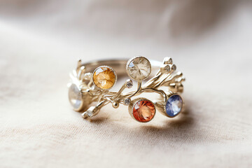 a ring with colorful stones on it