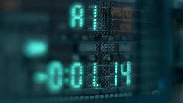 The level indicator of а music from professional recorder is glows blue and shows the decibel range and overload area with high accuracy. Closeup. Macro. Shallow depth of field