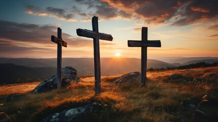 three wooden chrsitian crucifix crosses on hill at sunset - obrazy, fototapety, plakaty