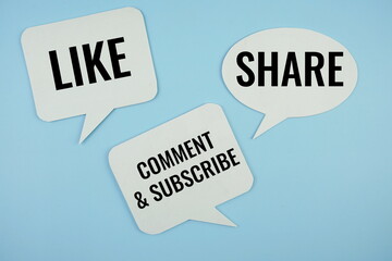 Social media concept with Like, Share, Comment & Subscirbe text message on buble speech on blue...