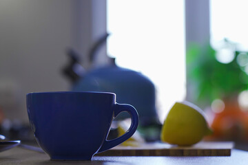 Steam from hot drink from cup on kitchen table