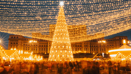 People in front of Christmas tree