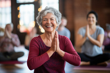 A senior woman engaging in a yoga class alongside a group of participants