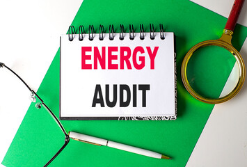 ENERGY AUDIT text on notebook on green paper
