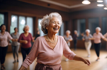 Senior woman dancing in a group dance class, leading active and healthy lifestyle. Retirement hobby and leisure activity for elderly people. - obrazy, fototapety, plakaty