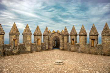 Detail of the battlements of a tower of the castle of Almodovar del Rio, Córdoba, Andalusia, Spain