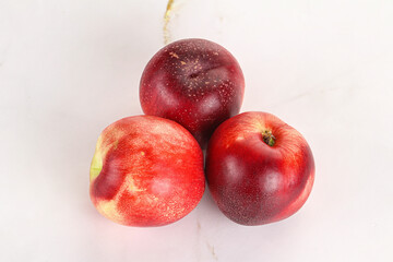 Ripe sweet juicy nectarines heap