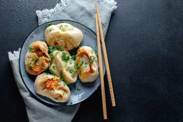 Stuffed dumplings with vegetables on plate