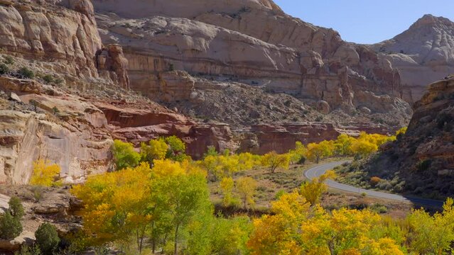 Establishing shot of mountain trail with red rocks in Hickman Natural Bridge Trail, Capital Reef National Park, Utah, North America. ProRes 422 HQ.