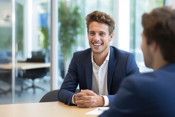 An interview scenario in an IT office setting, the interviewer is a young man in his 30's and the interviewee is a young man in his 20's, natural daylight photography, photorealistic,  - obrazy, fototapety, plakaty