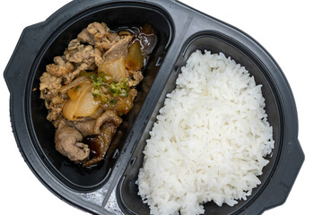 Japanese style lunch box with beef, rice and vegetables in black plastic container on white background
