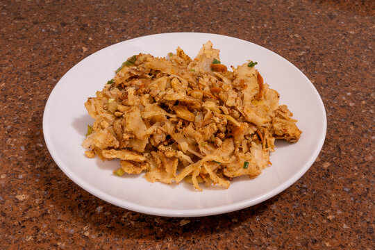 Sri Lankan kottu roti on a white plate